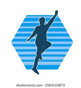 Silhouette of a male dancer in action pose. Silhouette of a slim man in dancing pose.