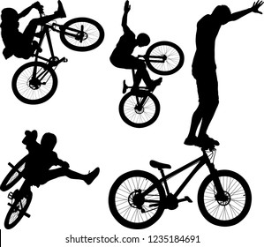 silhouette of male doing bike trick