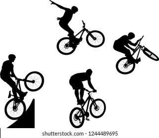 silhouette of male doing bike trick
