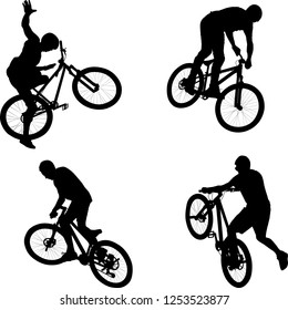 silhouette of male doing bike trick
