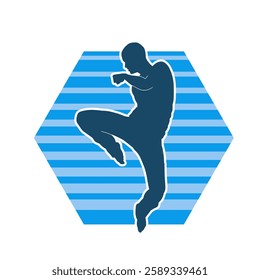 Silhouette of a male doing martial art kick pose. Silhouette of a martial art male doing kicking pose.