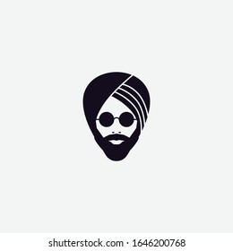 silhouette of a male head with a beard in a Sikh turban and glasses