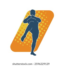 Silhouette of a male kickboxer athlete in action pose. Silhouette of a sporty man doing kicking pose.