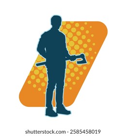 silhouette of a male lumberjack holding broad axe tool. silhouette of a forest worker standing ang holding a tomahawk.