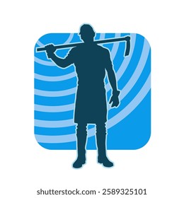 silhouette of a male lumberjack holding broad axe tool. silhouette of a forest worker standing ang holding a tomahawk.