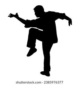 Silhouette of a male model doing martial art kick pose. Silhouette of a martial art kicking pose.