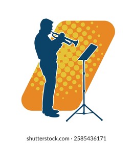 Silhouette of a male musician playing trumpet musical instrument.  Silhouette of a performing musician