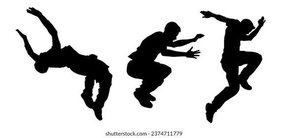 Silhouette of male parkour athlete in action. Silhouette of young man doing parkour jump. 