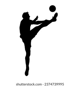 Silhouette of a male soccer player kicking a ball. Silhouette of a football player in action pose.