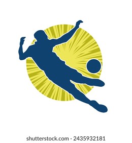 Silhouette of a male soccer player kicking a ball. Silhouette of a football player in action pose.