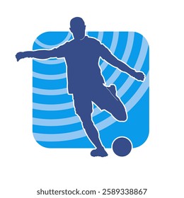 Silhouette of a male soccer player kicking a ball. Silhouette of a football player in action pose.