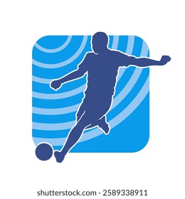 Silhouette of a male soccer player kicking a ball. Silhouette of a football player in action pose.