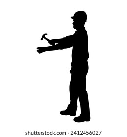 Silhouette of a male worker doing painting work. Silhouette of an interior painter worker.