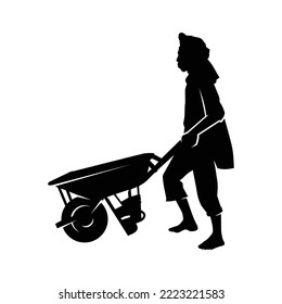 Silhouette of Male Worker Pushing Barrow.