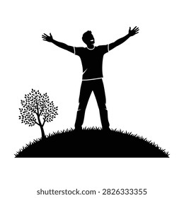 Silhouette of a man with arms outstretched standing on a hill feeling joyful and carefree outdoors