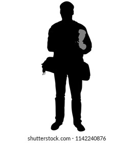 silhouette of a man with camera and flash
