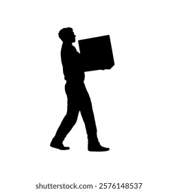 Silhouette of a man carrying a heavy box in front of him