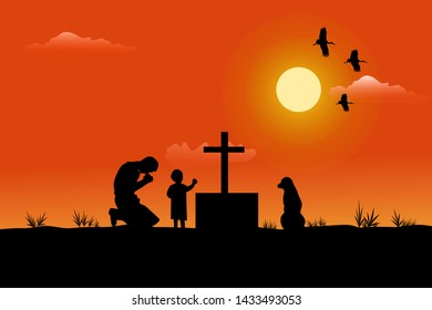 
The silhouette of a man and a child has a dog beside him. Being sad at the grave Has a sunset background