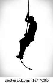 Silhouette Of A Man Climbing A Rope