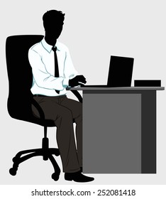 silhouette man at the Desk with laptop