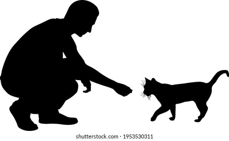 silhouette of a man feeding a cat