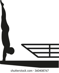Silhouette of man at a high diving platform