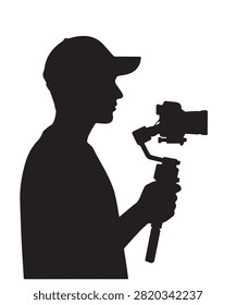 Silhouette of a man holding a camera with a motorized gimbal stabilizer for smooth video recording and vlogging.