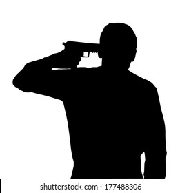 Silhouette of man holding gun against own head