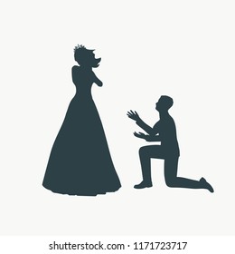 Silhouette of man in kneel pose. Man asking woman to marry him.