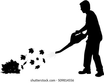 Silhouette of a man with a leaf blower.