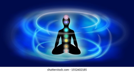 Silhouette of a man in lotus position with luminous chakras and aura on a foggy blue shine background. Concept illustration for yoga, meditation, relax, recreation, healthy lifestyle.