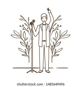 silhouette of man with microphone and branches and leaves in the background