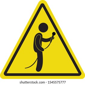 Silhouette of man with microphone on speech. Yellow triangle sign with man holding microphone in hands.
