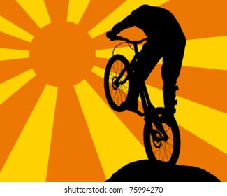 Silhouette of a man on mountain bike