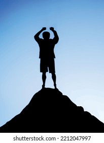 silhouette of a man on top of mountain