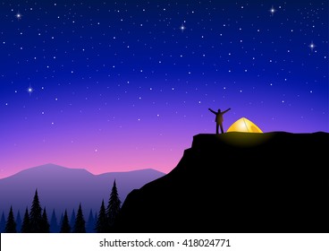 Silhouette of a man on top of a mountain stand near tent looking at the beautiful scenery
