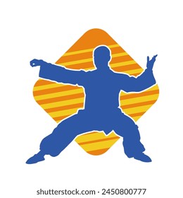 Silhouette of a man in oriental martial art pose. Silhouette of a male in martial art move.