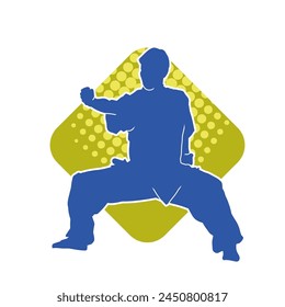 Silhouette of a man in oriental martial art pose. Silhouette of a male in martial art move.