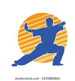 Silhouette of a man in oriental martial art pose. Silhouette of a male in martial art move.