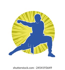 Silhouette of a man in oriental martial art pose. Silhouette of a male in martial art move.