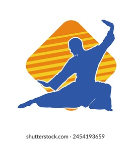 Silhouette of a man in oriental martial art pose. Silhouette of a male in martial art move.