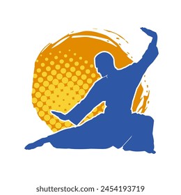 Silhouette of a man in oriental martial art pose. Silhouette of a male in martial art move.