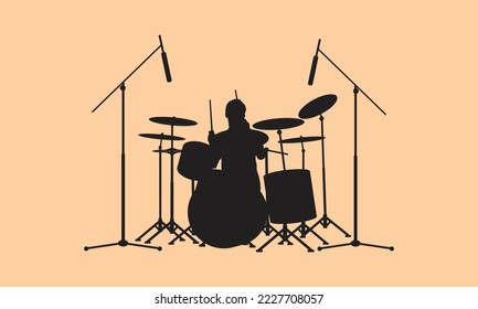 silhouette of man playing music drums