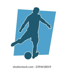 Silhouette of a man playing soccer. Silhouette of a football player in action pose.