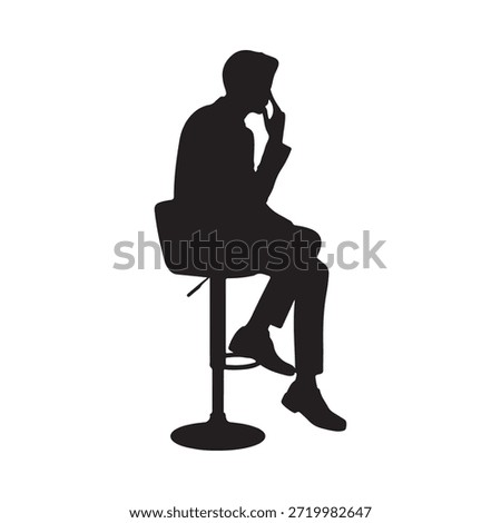 Silhouette of a man seated on a stool deep in thought and contemplation