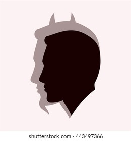 Silhouette of man with shadow devil.