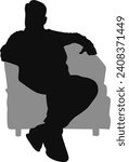 silhouette man sitting on armchair