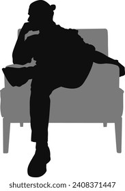 silhouette man sitting on armchair