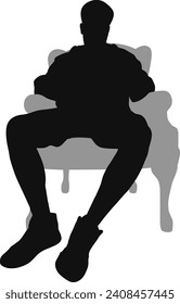 silhouette man sitting on armchair