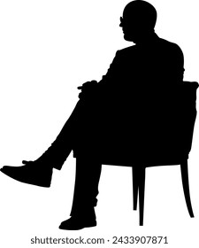 silhouette man sitting on armchair